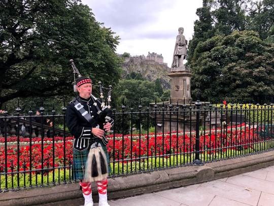 Scottish bagpiper outside Edinburgh Castle